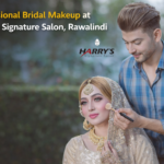 This image showcases a skilled makeup artist applying bridal makeup at Harryโs Signature Salon, Rawalpindi. The salon is known for professional bridal styling, premium beauty services, and expert grooming using modern techniques and high-quality products.